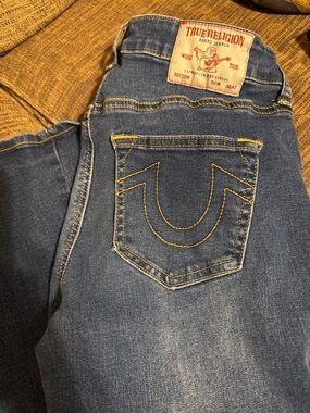 True Religion blue jeans with yellow stitch accents